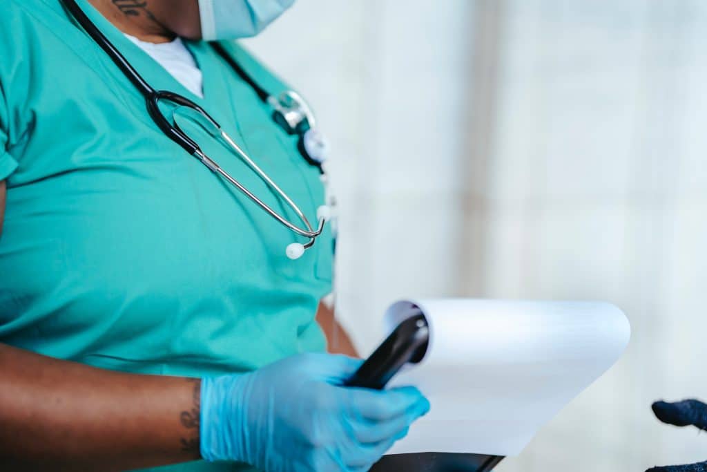 closeup shot of doctor holding clipboard